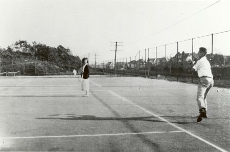 On the tennis courts of the Kew Gardens Country Club on Austin Street east of Lefferts Boulevard in Kew Gardens, NY.