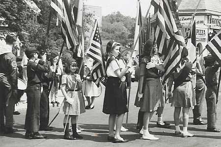 Memorial Day Parade on Lefferts Boulevard in Kew Gardens, NY in 1963.  The Homestead Hotel and Dani's Pizzeria can be seen in the background.