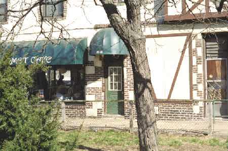 This is a closer look at the back of the 2 story Tudor building.   Kitty Genovese was attacked for the second and last  time in a small hallway behind this door [82-62 Austin Street].