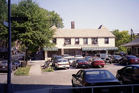 This is the parking lot adjacent to the Kew Gardens Long Island Railroad Station on Austin Street as it appears today.